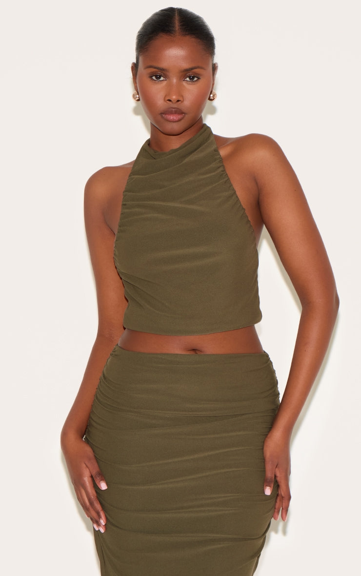 https://cdn-img.prettylittlething.com/0/a/2/a/0a2ae3a980ac4aff9248d31fc9e593c7d72a00f5_CNL4953_1_khaki_soft_touch_ruched_halter_crop_top.jpg
