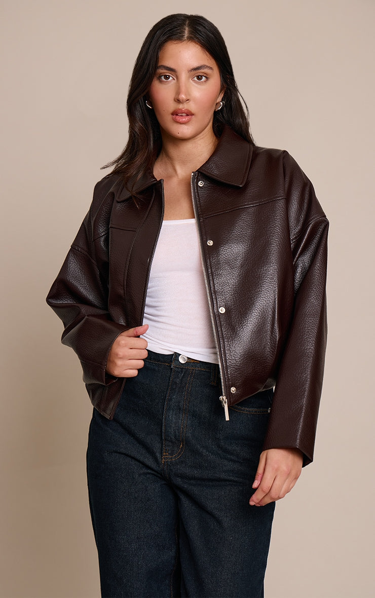 https://cdn-img.prettylittlething.com/0/e/2/6/0e261dfc2ee889a1e04d17b303d4af7c3544960f_CNO8019_1_bitter_chocolate_faux_leather_covered_placket_bomber_jacket.jpg