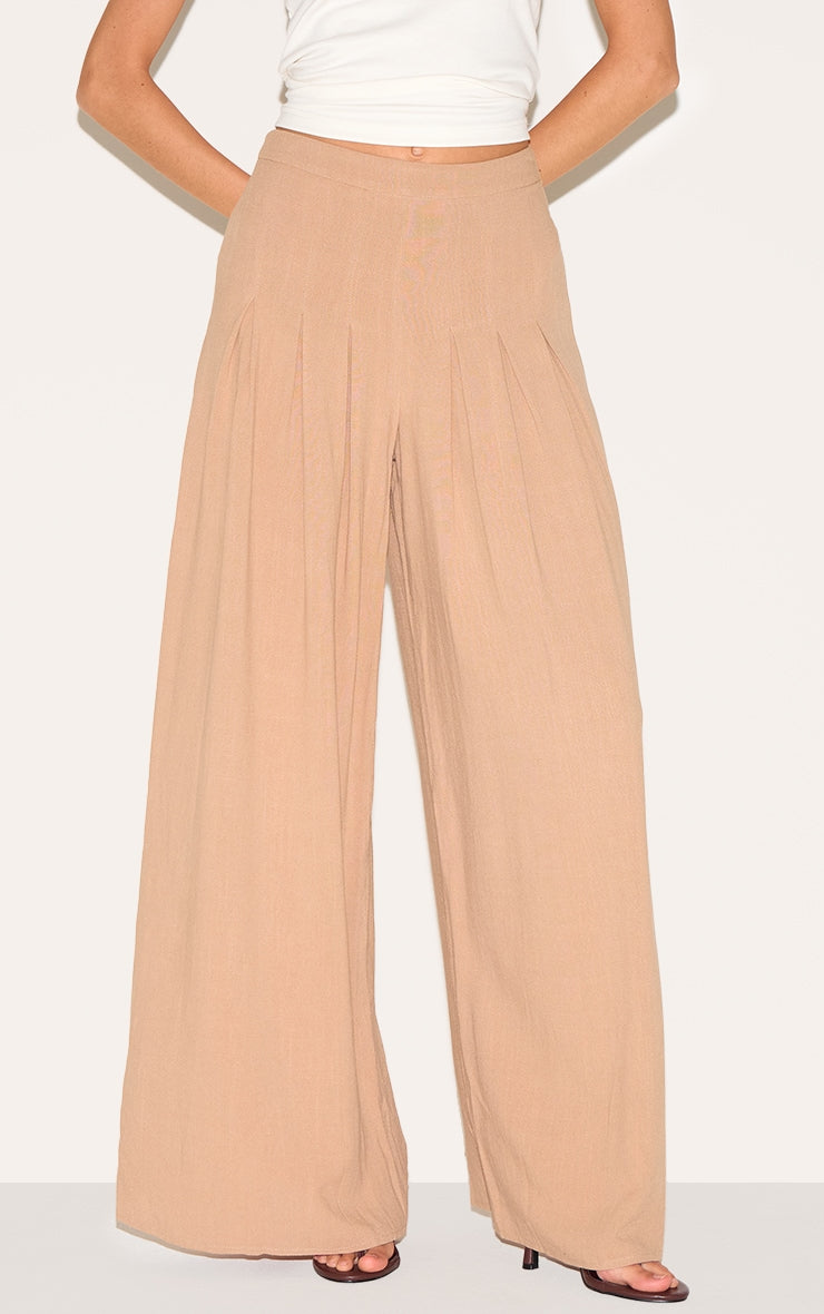 https://cdn-img.prettylittlething.com/0/f/8/0/0f80fcf9c867a1d64fcb1bb92d07eb40109212f9_CNM4241_2_mocha_linen_blend_floaty_pin_tuck_wide_leg_trousers.jpg