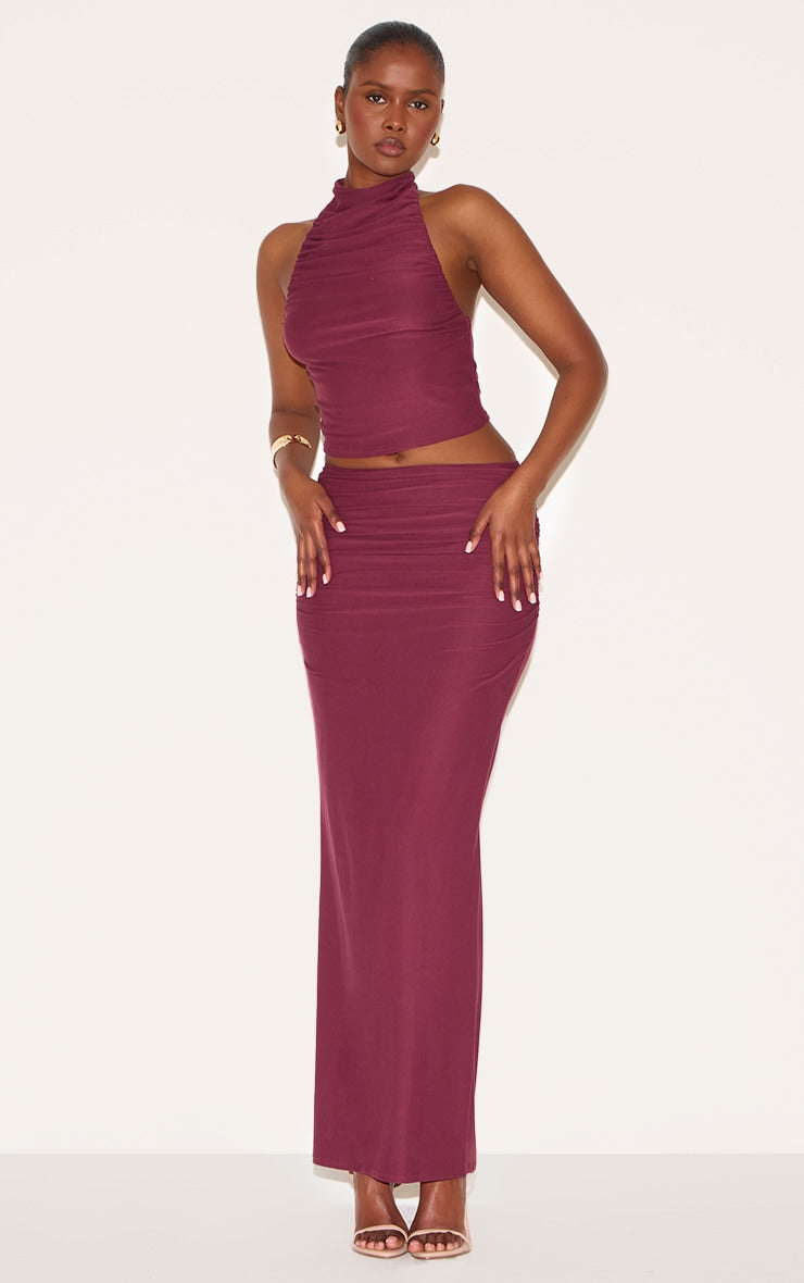 https://cdn-img.prettylittlething.com/1/1/0/e/110e3151af7aeb987d70998413e648afacec684f_CNN0616_3_wine_soft_touch_ruched_halter_crop_top.jpg