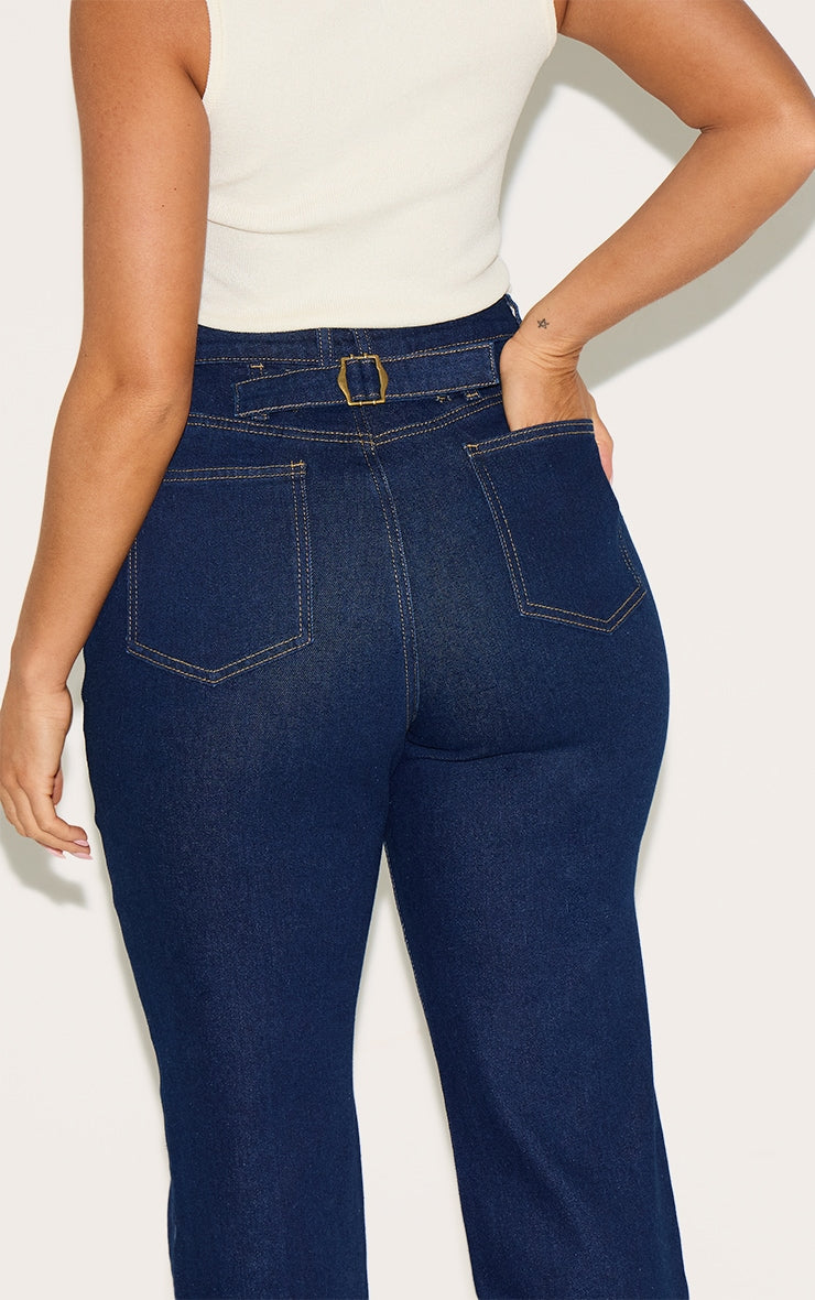 https://cdn-img.prettylittlething.com/2/1/0/0/2100917b6875463eb4db072acdff4918e75ace48_CNM1000_4_shape_indigo_stretch_denim_highwaisted_pintuck_adjustable_back_detail_jeans.jpg