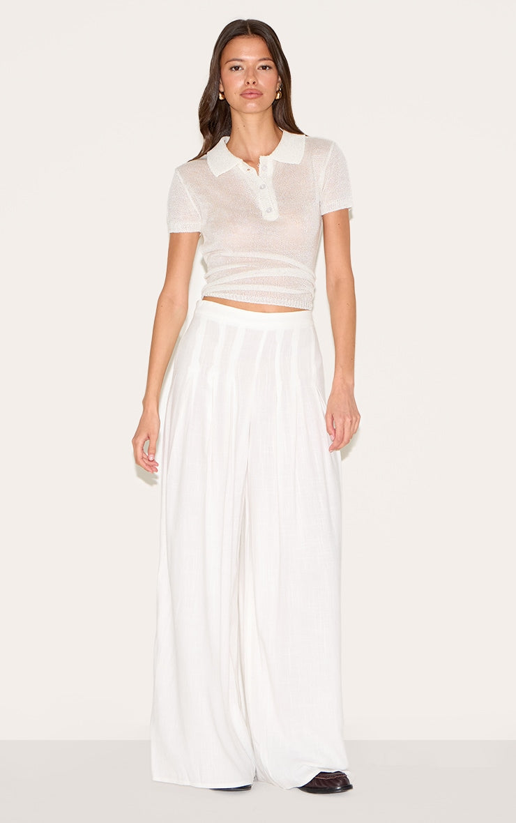 https://cdn-img.prettylittlething.com/3/3/2/9/3329e8faa2b0fa80241a37e4e2ac161570d902a8_CNM4243_1_white_linen_blend_floaty_pin_tuck_wide_leg_trousers.jpg