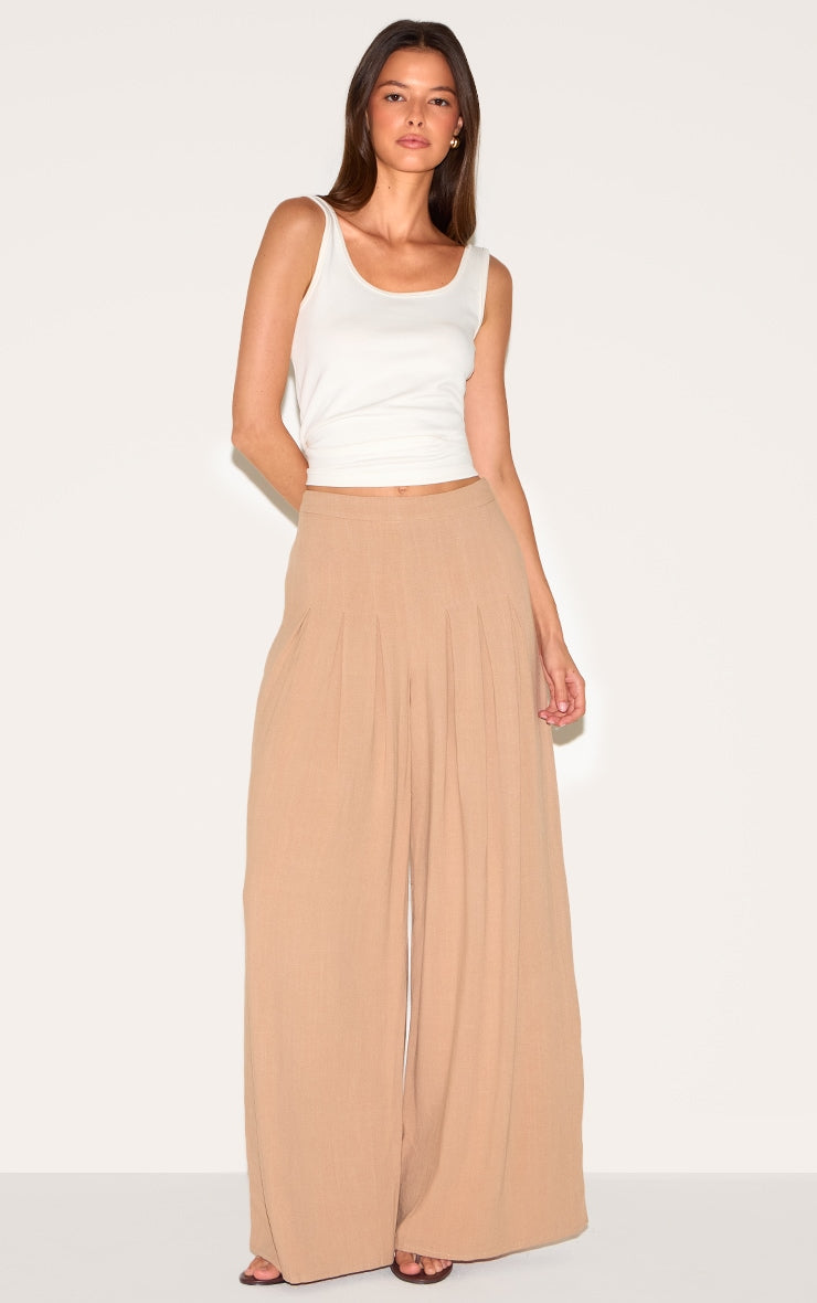 https://cdn-img.prettylittlething.com/3/a/e/7/3ae7c1fdfbdbb03eea516a70e362379719769da5_CNM4241_1_mocha_linen_blend_floaty_pin_tuck_wide_leg_trousers.jpg