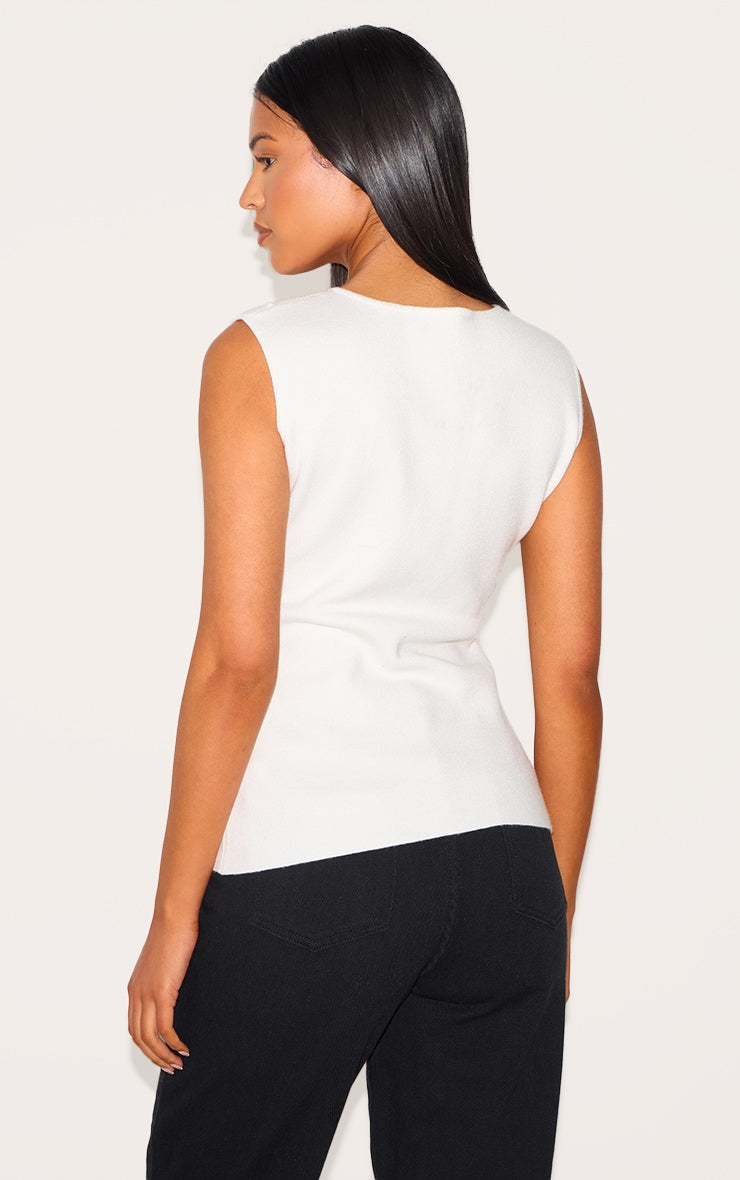 https://cdn-img.prettylittlething.com/4/a/1/7/4a17e6862ad49a5241761fd0fffd8ff164732d2a_CNM1166_2_tall_white_cinched_button_up_knit_vest_top.jpg