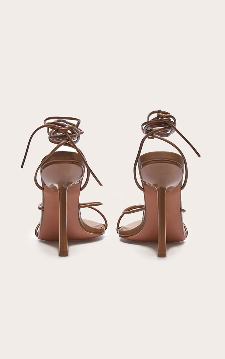 https://cdn-img.prettylittlething.com/5/9/9/1/59912ab43bcd1f6432109b947728c02f30b92ff7_CNL8254_3_plt_label_tobacco_strappy_tie_thong_heel.jpg