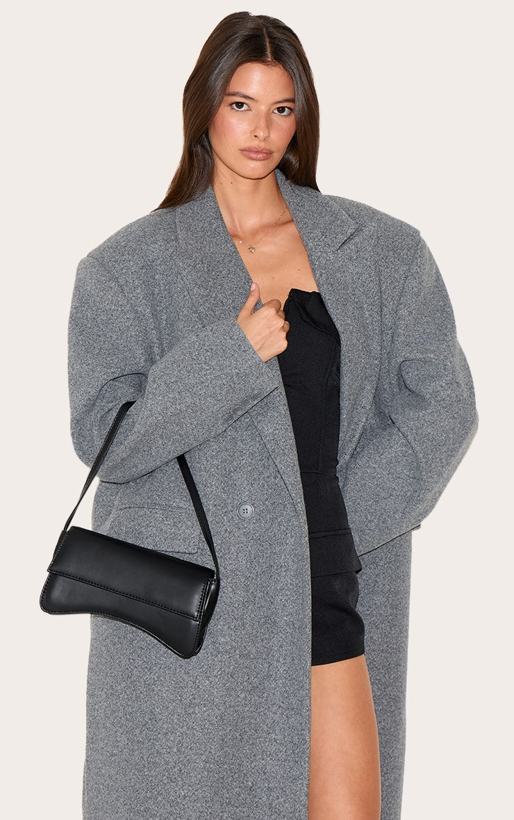 https://cdn-img.prettylittlething.com/5/a/a/f/5aaf1963c0928f4c620ff6f4b574c88550530e75_CMO4899_5_black_pu_flap_over_baguette_shoulder_bag.jpg