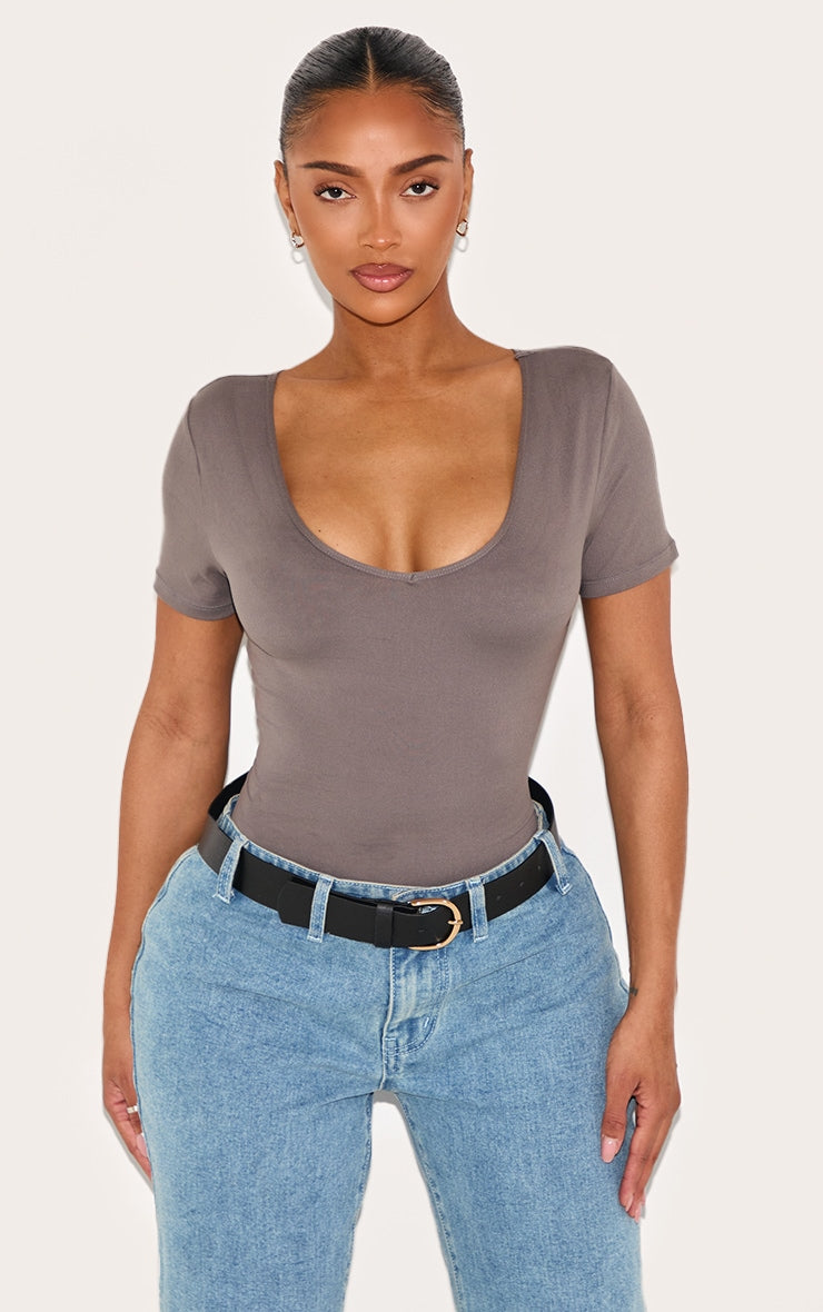 https://cdn-img.prettylittlething.com/5/e/3/e/5e3e6a4713929c9c7cc191c49f2fa1a7733eeae5_CNL9497_1_shape_charcoal_sculpted_v_neck_short_sleeve_bodysuit.jpg