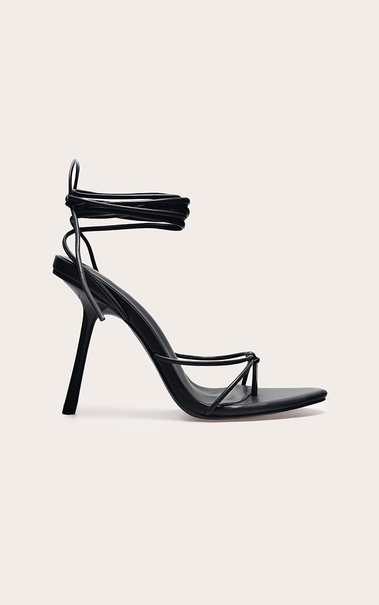 https://cdn-img.prettylittlething.com/6/8/d/6/68d6eaa2413f777ae4c030fe8e95cdd0564c870a_CNL8253_1_plt_label_black_strappy_tie_thong_heel.jpg
