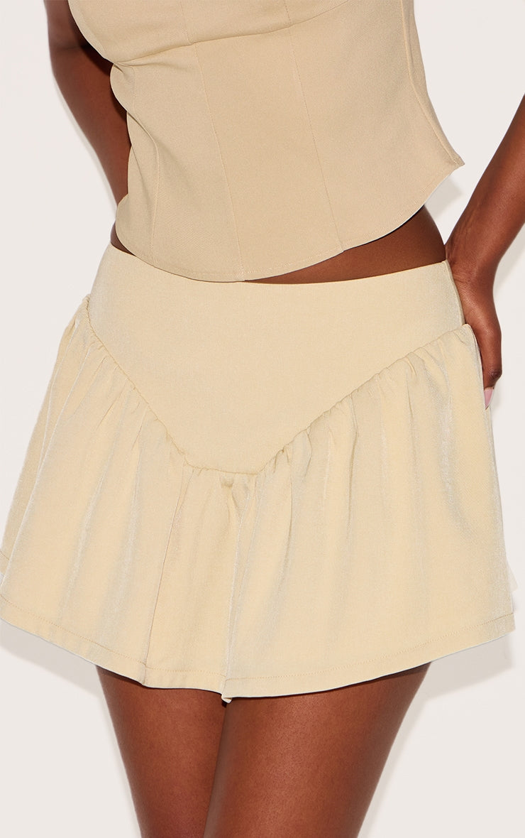 https://cdn-img.prettylittlething.com/6/e/2/c/6e2c65d7529736e5aeb95abcbbfdd089dd642617_CNL9201_5_butter_cream_dipped_waist_structured_a_line_mini_skirt.jpg