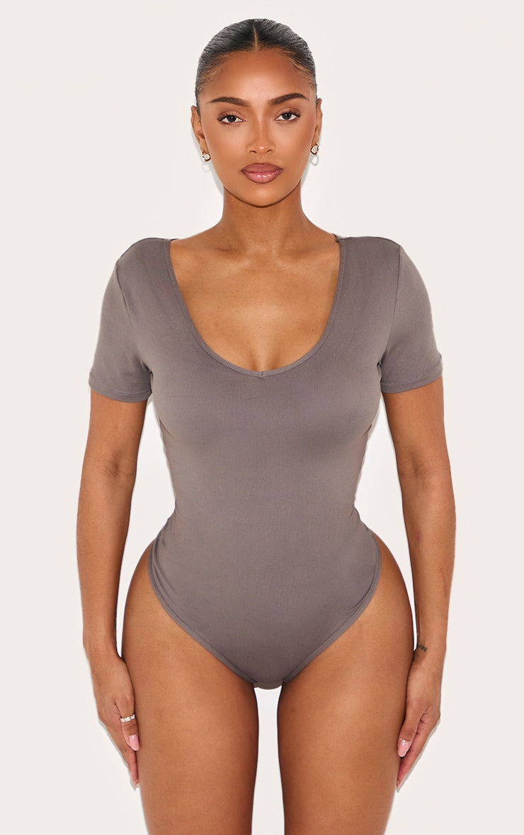 https://cdn-img.prettylittlething.com/7/e/b/0/7eb05782db735347cfa0af93a025d20feaaab37a_CNL9497_2_shape_charcoal_sculpted_v_neck_short_sleeve_bodysuit.jpg