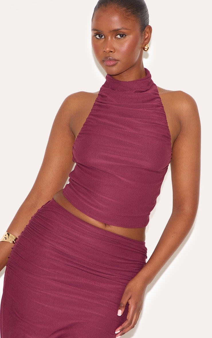 https://cdn-img.prettylittlething.com/8/0/b/e/80bedc497cc2ff10a1283220ba064ba66fddc622_CNN0616_1_wine_soft_touch_ruched_halter_crop_top.jpg