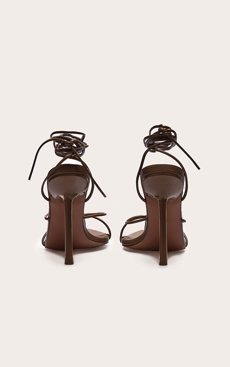 https://cdn-img.prettylittlething.com/8/6/8/e/868e6ba8f3ff94b12cdd5da5b11dac6005171a5b_CNL8252_3_plt_label_dark_chocolate_strappy_tie_thong_heels.jpg