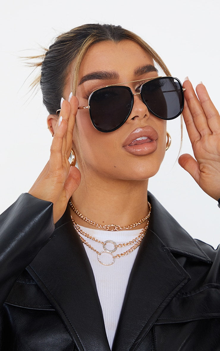 https://cdn-img.prettylittlething.com/8/b/1/a/8b1a11f3def24400ae184be4a105787a9a22d7c4_CMP9798_1_black_oversized_gold_detail_aviator_sunglasses.jpg