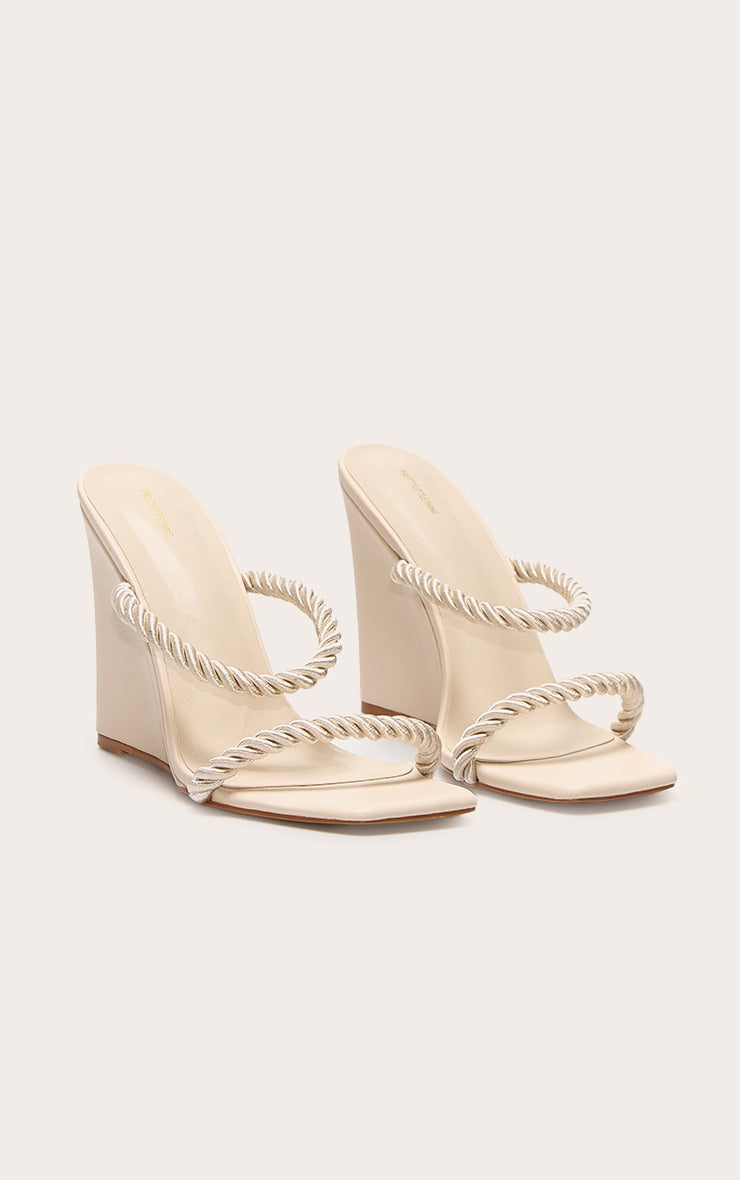https://cdn-img.prettylittlething.com/9/a/e/6/9ae60b7d43d898f00d26e6fa73e78e2df70b9d46_CNL8091_2_natural_rope_square_toe_high_heeled_mule_wedges.jpg