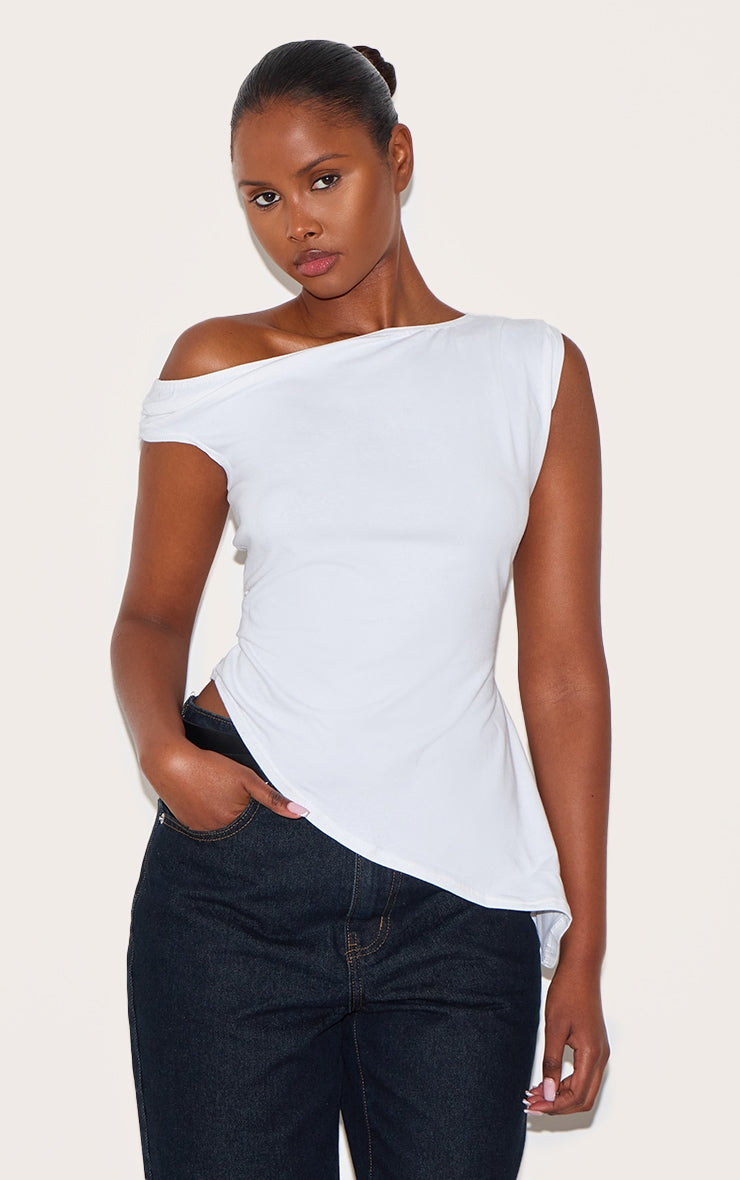 https://cdn-img.prettylittlething.com/9/d/0/e/9d0e4b16214a1a40488c4c57d2fd07dd08d0ff64_CNL8996_1_white_asymmetric_shoulder_extreme_longline_top.jpg