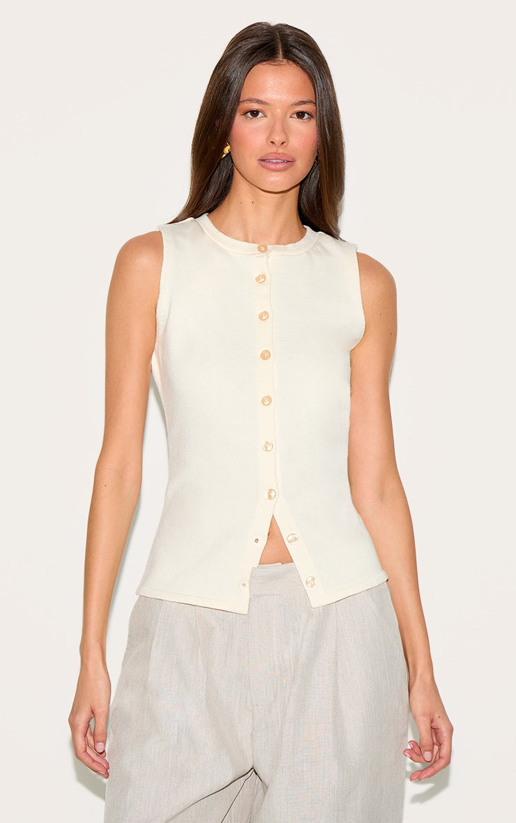 https://cdn-img.prettylittlething.com/9/e/9/6/9e96fefd6a5db4ae327001058be936113bea6454_CNM9205_1_cream_button_through_sleeveless_top.jpg