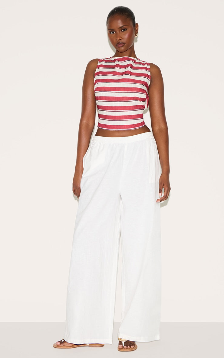 https://cdn-img.prettylittlething.com/a/0/f/3/a0f3f45753fd1754049da45a8b72638552a744e3_CNM5393_3_tomato_red_striped_cotton_tie_back_detail_top.jpg
