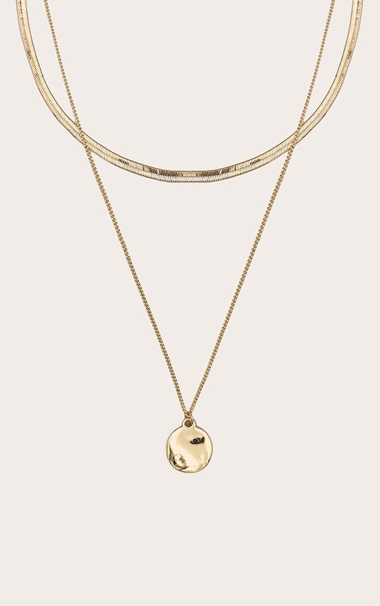 https://cdn-img.prettylittlething.com/b/f/8/0/bf80ac735d657f7964af2e929042a5da17523d50_CNM0656_1_gold_circle_pendant_layered_snake_chain_necklace.jpg