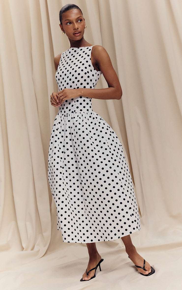 https://cdn-img.prettylittlething.com/c/7/1/b/c71bb6f59aa5cfa635e56c82b689481607cdf735_CNL8368_3_monochrome_polka_dot_printed_dropped_waist_midaxi_dress.jpg