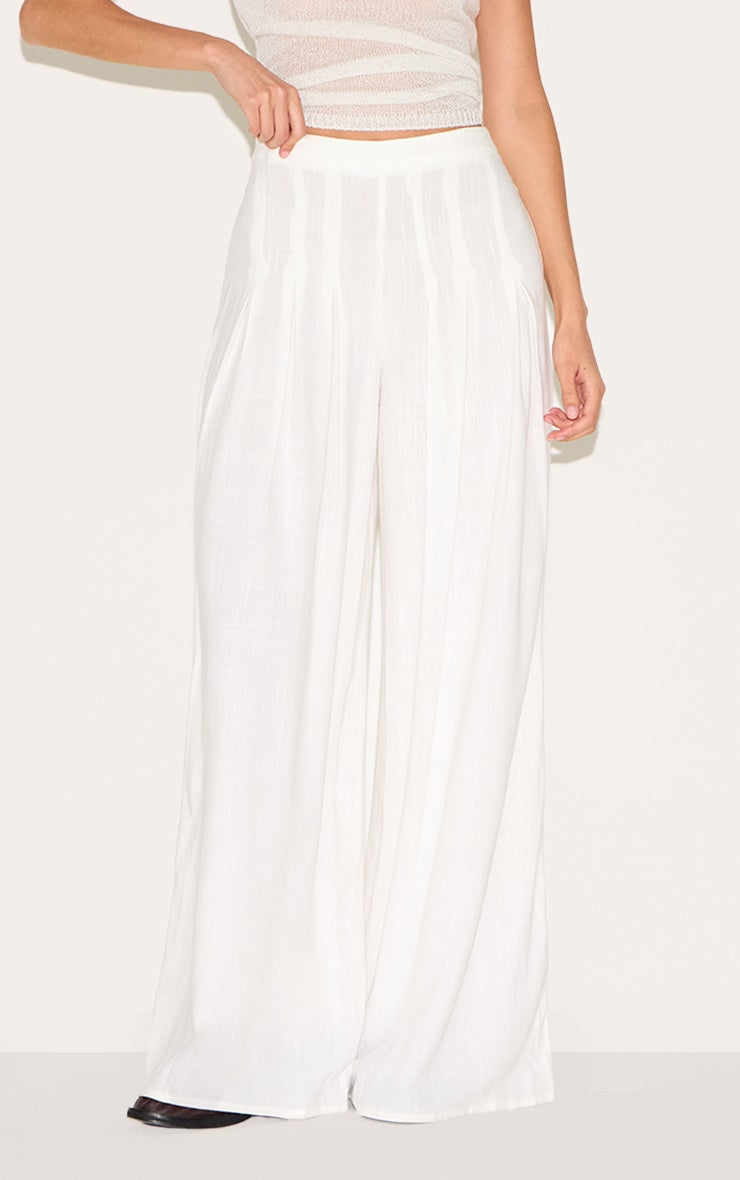 https://cdn-img.prettylittlething.com/d/6/c/5/d6c59ca54400636deecbf1281828be39cdfe463e_CNM4243_2_white_linen_blend_floaty_pin_tuck_wide_leg_trousers.jpg