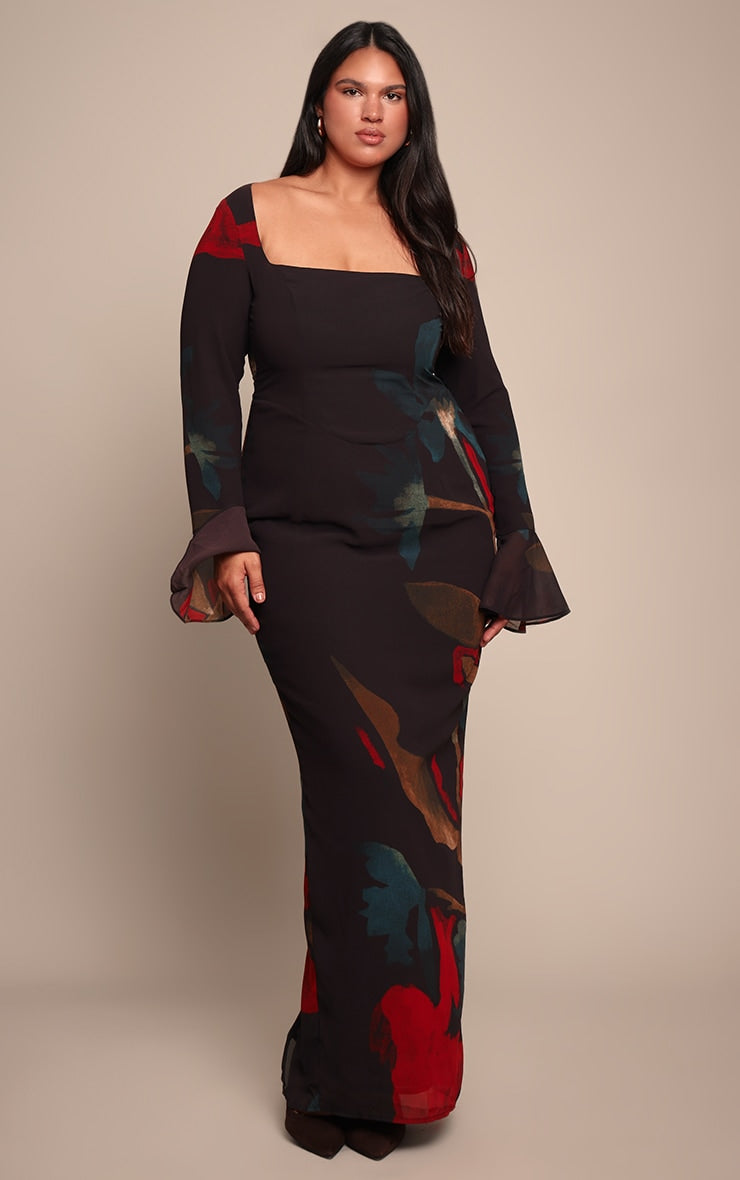 https://cdn-img.prettylittlething.com/f/1/5/4/f154ec6ec0ece42d4a093534f5725ce61e79377d_cno7971_1_plus_black_floral_print_chiffon_flute_sleeve_maxi_dress.jpg