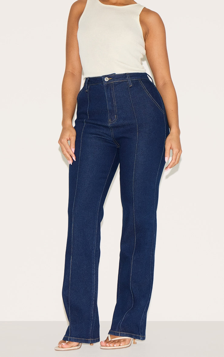 https://cdn-img.prettylittlething.com/f/2/5/6/f25661c5ea824595d19a6f1a7b0e96a4e0e114b6_CNM1000_2_shape_indigo_stretch_denim_highwaisted_pintuck_adjustable_back_detail_jeans.jpg