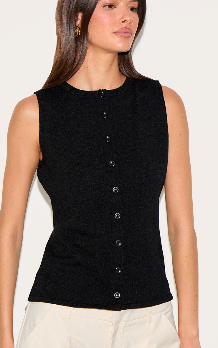 https://cdn-img.prettylittlething.com/f/5/0/6/f50682dd5ec7d0468ea182c958449e31b7499ad8_CNM9207_4_black_button_through_sleeveless_top.jpg