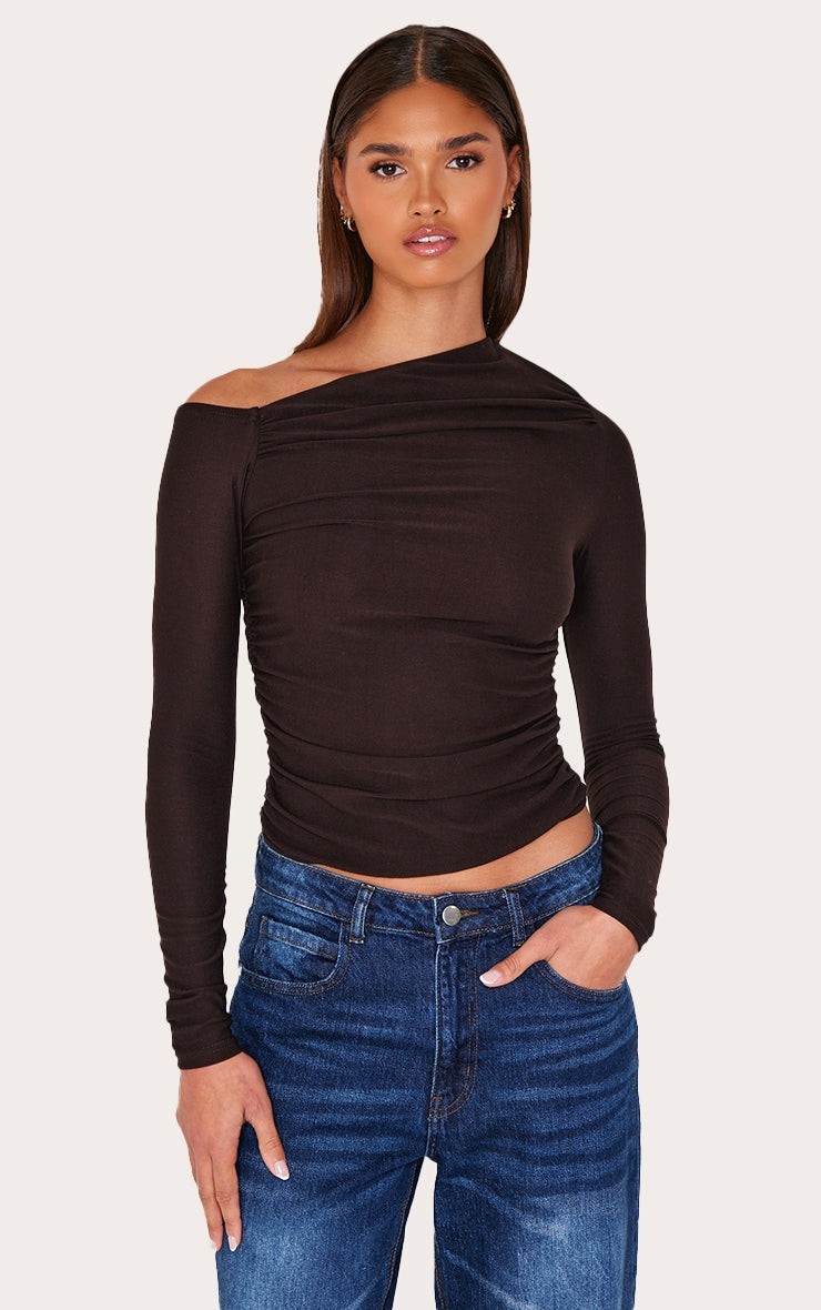 https://cdn-img.prettylittlething.com/f/6/a/d/f6ad412587cd76e2dd1e43559ae1979354e48c2d_CNL8980_1_chocolate_soft_touch_asymmetric_detail_long_sleeve_top.jpg